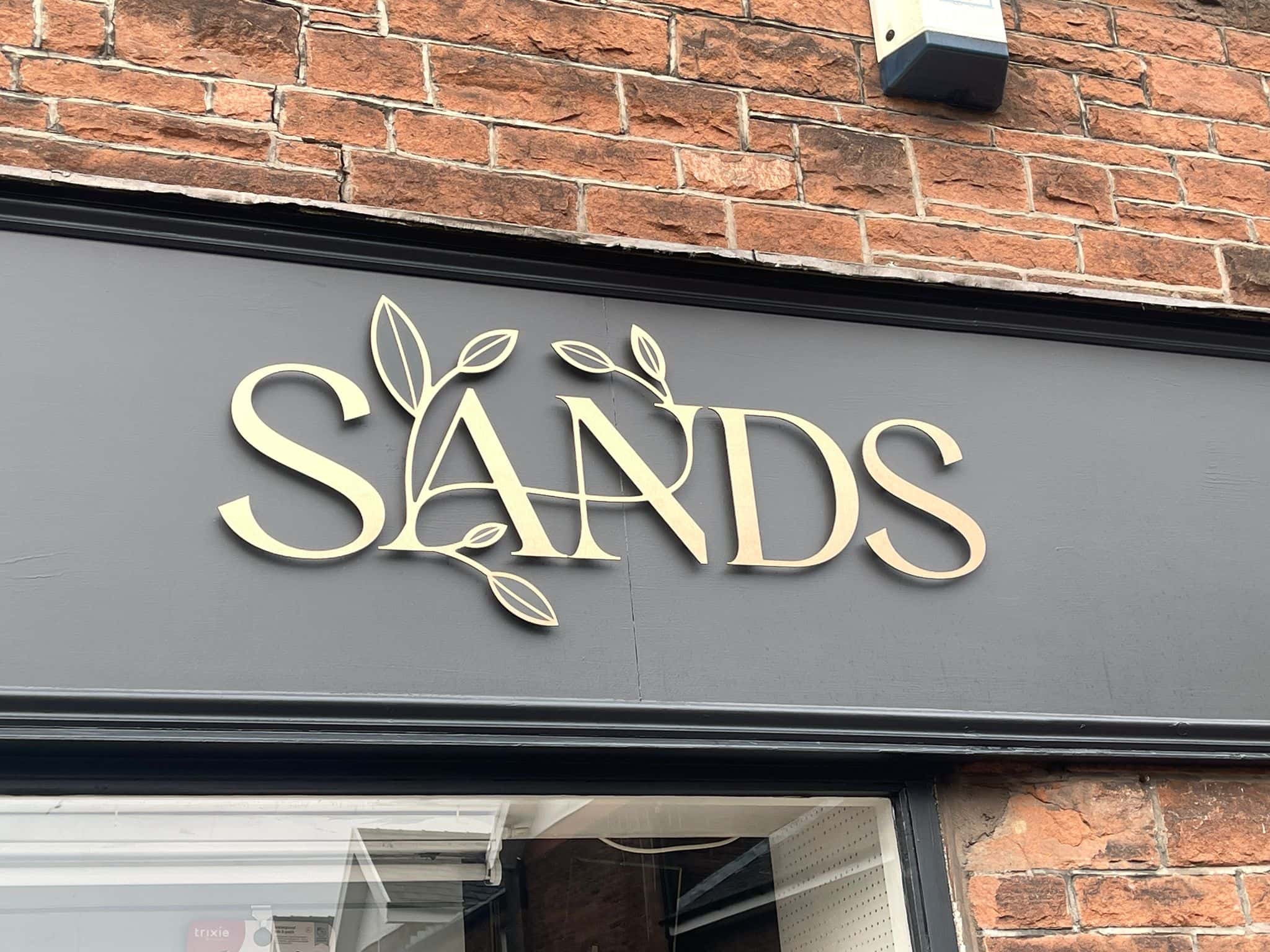 Installed SANDS shop fascia in Penrith by VinylFX — bespoke shop signs and fascia signs Cumbria